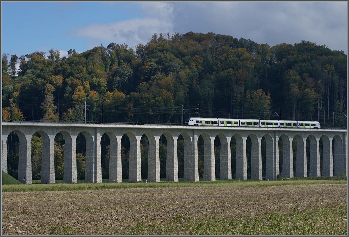 A BLS RABe 528 MIKA is on the way as IR 66 3222 from La Chaux de Fonds to Bern and drives straight to Gümmenen over the striking, 293 meter long Gümmen viaduct.

October 5, 2024