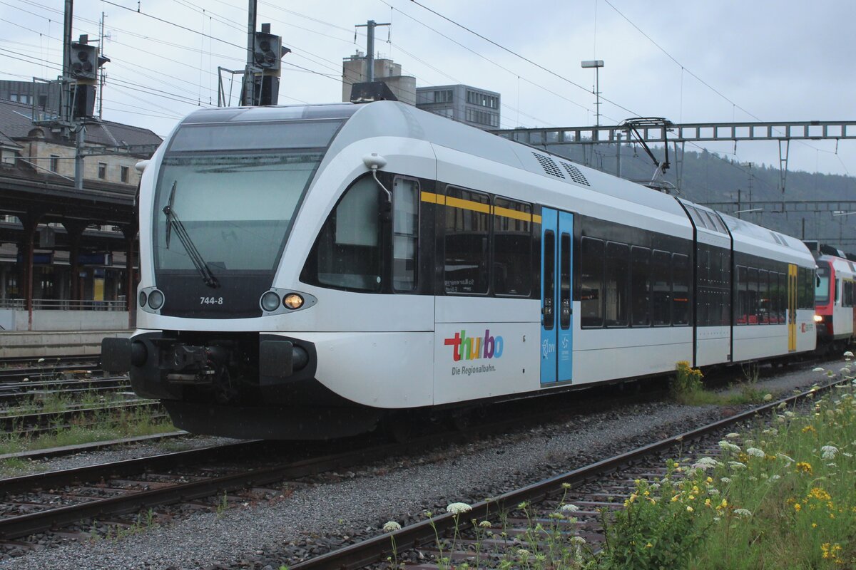 On a rainy 22 June 2024 ThurBo 744-8 stands sidelined at Brugg AG. 