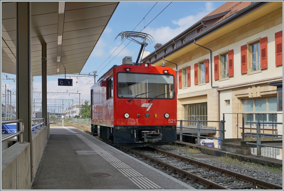 The CJ Gem 2/2 521 is waiting to depart in La Chaux de Fonds. 

June 26, 2024