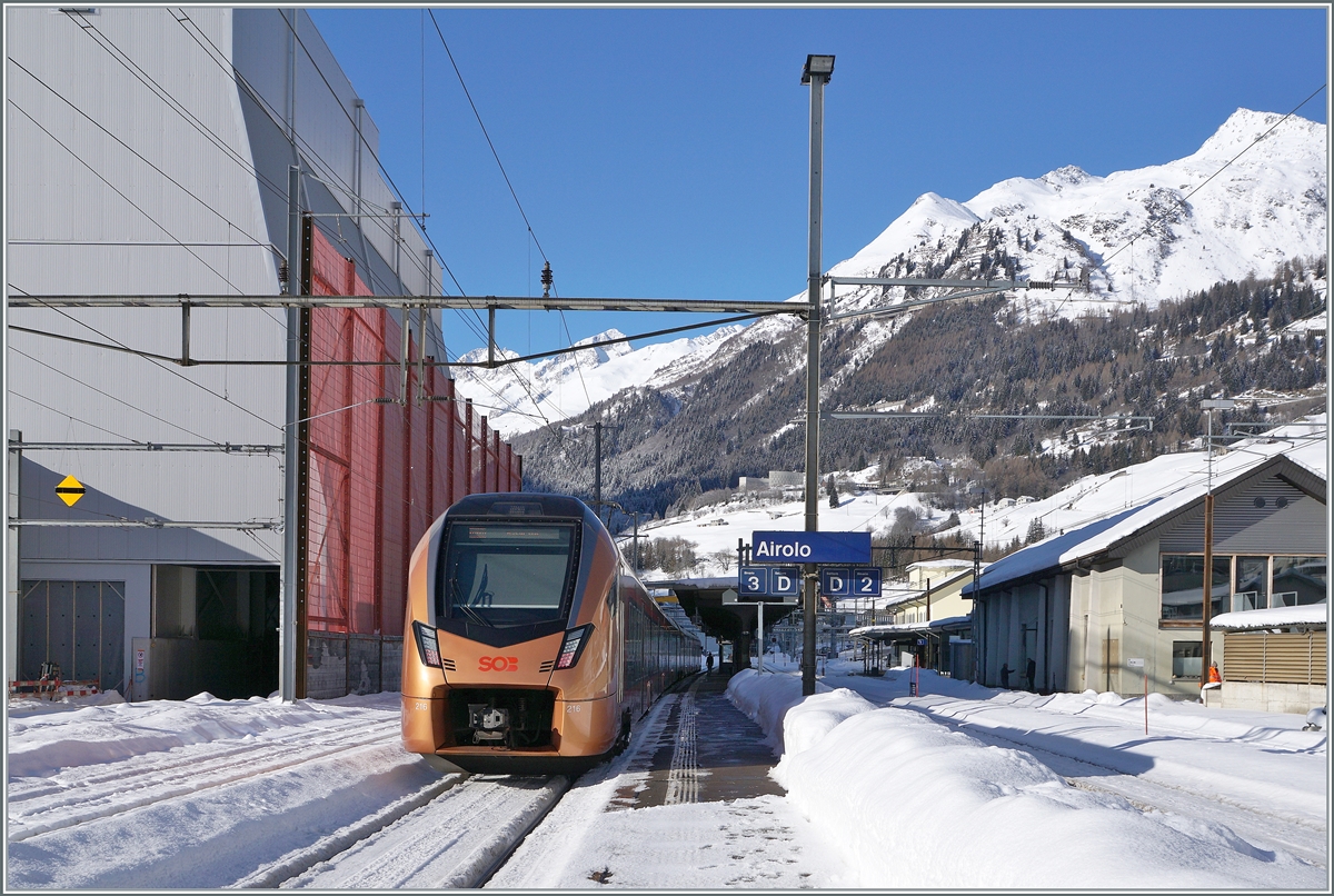 The SOB RABe 526 216 as IR 26 2320 from Locarno to Basel SBB has reached the snowy Airolo. 

January 21, 2025