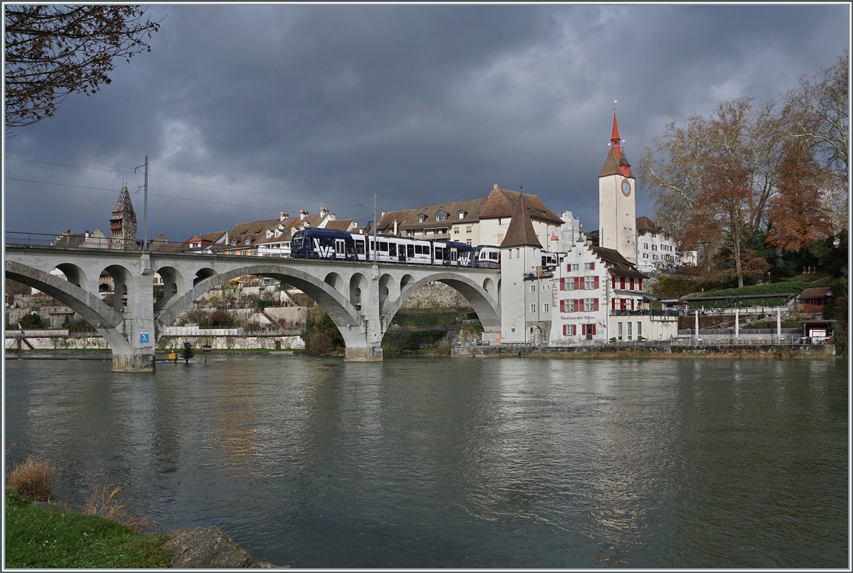 Two AVA BDWM Abe 4/8  Diamant  in different colors are on the journey from Dietikon to Wohlen as S17 shortly after the Bremgarten Obertor stop (which is not served during the Christmas market) in almost dramatic lighting conditions.

December 6, 2024