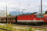 BB 1144 210 with coal train waits at Rosenheim on 1 June 2006.