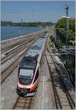 A ÖBB ET 4024 is leaving the Lindau Insel Station on the way to Bludenz.