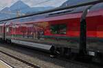 Passenger car of the new Railjet generation, (A-BB 73 81 22-91 5xx-x Bmpz), economy class, 72 seats. Lined up on the train towards Innsbruck, taken at Jenbach train station. August 21, 2024