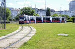 Tram 777  in the turnaround loop at Schottering Station in Vienna. Date: 19 May 2024.