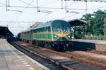 On 12 July 1989 NMBS 201.010 -en 5910- stands with an extra train at Roosendaal. 