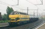 In the pouring rain 6261 with steel train passes Antwerpen Dam on 19 September 2004.