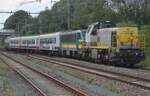 SNCB 7753 banks a special train through Saint-Ghislain on 17 August 2024. Because the normally held Chemins de Fer du Bocq festival was cancelled due to massive construction works on the Bocq line, some specials were organised by PFT-TSP (who also keep sway of the Bocq-line) reconoitring the once bustling industrial areas around Saint-Ghislain.