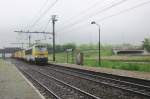 NMBS 1342 leaves Antwerpen Noorderdokken on a drabby morning of 30 May 2013.