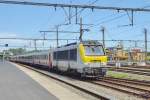 NMBS 1347 with EC-stock runs through Brugge on 22 May 2014.