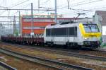 On 22 May 2014 NMBS 1303 hauls a steel train through Antwerpen-Berchem.