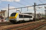 NMBS 1312 hauls a steel train through Antwerpen-Berchem on 10 June 2015.