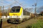 NMBS 1323 plus tank wagon train speeds through Antwerpen-Noorderdokken on 19 November 2016.