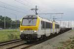 On a grey afternoon of 12 August 2017, NMBS 1348 passes Antwerpen-Luchtbal with a harbour bound train.
