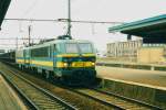 Scanned picture of an iron ore train, hauled by 2113 through Mechelen Centraal on 24 December 1996.