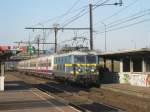 NMBS 2335 is about to call at Antwerpen-Noorderdokken on 3 March 2011. 