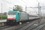 Belgian loco of German design (from Canadian factory) with Austrian coaches in the Netherlands: CoBRa 2802 with Benelux entering Dordrecht Centraal on a rainy 3 June 2012.