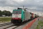 CoBRa 2808 is about to pass through Antwerpen-Luchtbal on 18 June 2014. The photo was taken from the platform; the camera aimed into the free field, giving this effect.