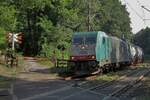 On a sunny 29 August 2015 CoBRa 2805 hauls an intermodal train through Venlo Bovenste Molen and gets photographed from behind the railway crossing.