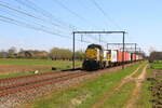 Locomotive 7725 from Lineas hauling a container train from Antwerpen to Gent-Zeehaven is passing in Lokeren, 1/4/2025.