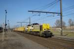 NMBS 7725 passing through Antwerpen Noorderdokken on a sunlit 13 March 2011.