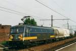 Scanned picture of 2556 with cereals train curving her way at Amtwerpen Dam on 15 May 2002.