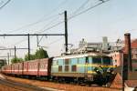 Peak Hour train headed by 2511 is about to call at Antwerpen Dam on 16 May 2002.