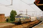 NMBS 2513 heads a train of automotives through Antwerpen Dam on 16 May 2002.