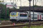 NMBS 1876 pulls IC stock into the sidings near Antwerpen-Noorderdokken on 21 May 2014.