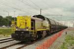 Zinc ore train hauled by NMBS 7722 speeds through Antwerpen-Luchtbal on 18 June 2014.