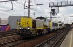 SNCB 7743 hauls a loco train through Antwerpen-Berchem.