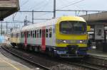 NMBS 903 calls at Antwerpen-Berchem in the rain on 3 September 2015.