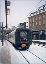 The DSB IC3  Rubber nose  2120 is ready for departure in Copenhagen during heavy snowfall.