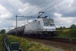 HSL 186 365 hauls a tank train through Tilburg-Reeshof on 21 July 2023.