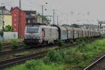 Akiem 37020 hauls a steel train through Köln West on 19 May 2022.