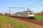 Locomotive 186 189 from Hexafret hauling locomotive 186 190 and a metal train to Antwerpen is passing in Lokeren, 1/4/2025.