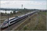 North of Bollène a road leads over the Rhone and then over two bridges to Lapalud. On the one hand, the two bridges lead over the LGV 75200 LN5 and barely twenty meters later over the route 830000 Paris - Marseille. The picture shows the SNCF INOIU TGV 2242 from Toulon to Colmar with the Rame 549 in the lead on the high-speed route 752 000 LGV Méditerranée LN5 at km 577.4 heading north. 

October 1, 2024