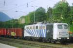 Lokomotion 139 260 banks a scrap train toward Brennero out of Kufstein on 27 May 2012. The photo was taken from behind a window of my train. 