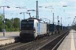 TX Log 193 130 hauls a container train through Celle on 2 May 2024.