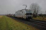 RTB Cargo 193 173 hauls a badly ;loaded container train through Kaarst Broicherseite on a weathery even worse 12 February 2026.