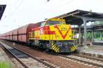 MEG 221 hauls a coal shuttle through Grosskorbetha on 29 May 2010.