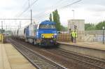 Alpha Trains (500) 1755 -rented by Veolia- speeds with cereals train through Antwerpen Luchtbal on 21 February 2012.