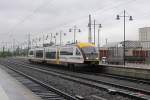 In miserable weather, VVO 643 043 passes Dresden Hbf on 3 June 2013.