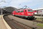 DB 111 054 enters Köln Hbf on 27 April 2018. 