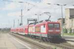 DB 112 138 'OTTO hat Zugkraft' pushes an RE to Leipzig Hbf out of Magdeburg Hbf on 29 April 2011.