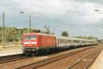 On a sunny 15 July 2001, 112 158 with Belgian I-11 stock calls at Dren. 