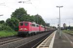 Coaltrain, headed by 140 858, speeds through Bonn-Beuel on a grey 28th of May 2014.