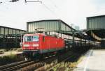 On 22 July 2000 143 815 pushes an S-Bahn into Duisburg Hbf.