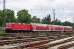 S-Bahn with 143 267 to Frankfurt (Main) calls at Darmstadt-Kranichstein on 30 May 2014.