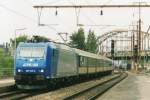 Scanned picture of Alpha Trains 185 519 in mercenary service of CFL, with a stopping train calling at Esch-sur-Alzette on 20 May 2004.